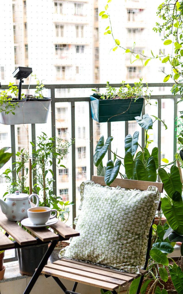 Small balcony garden sit out with chair and table