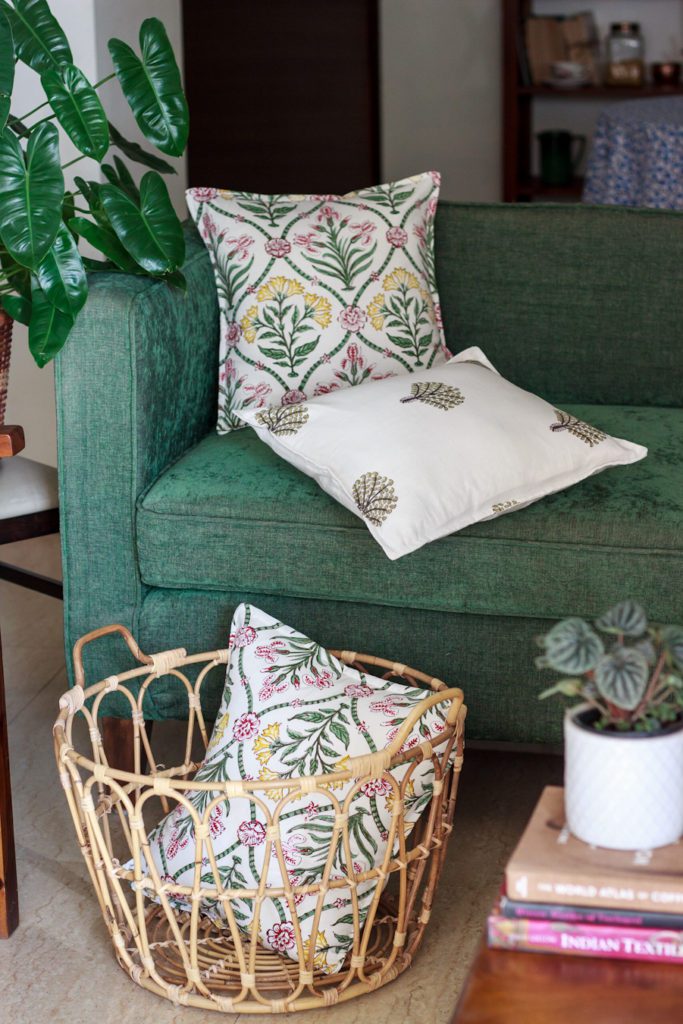Green three seater sofa